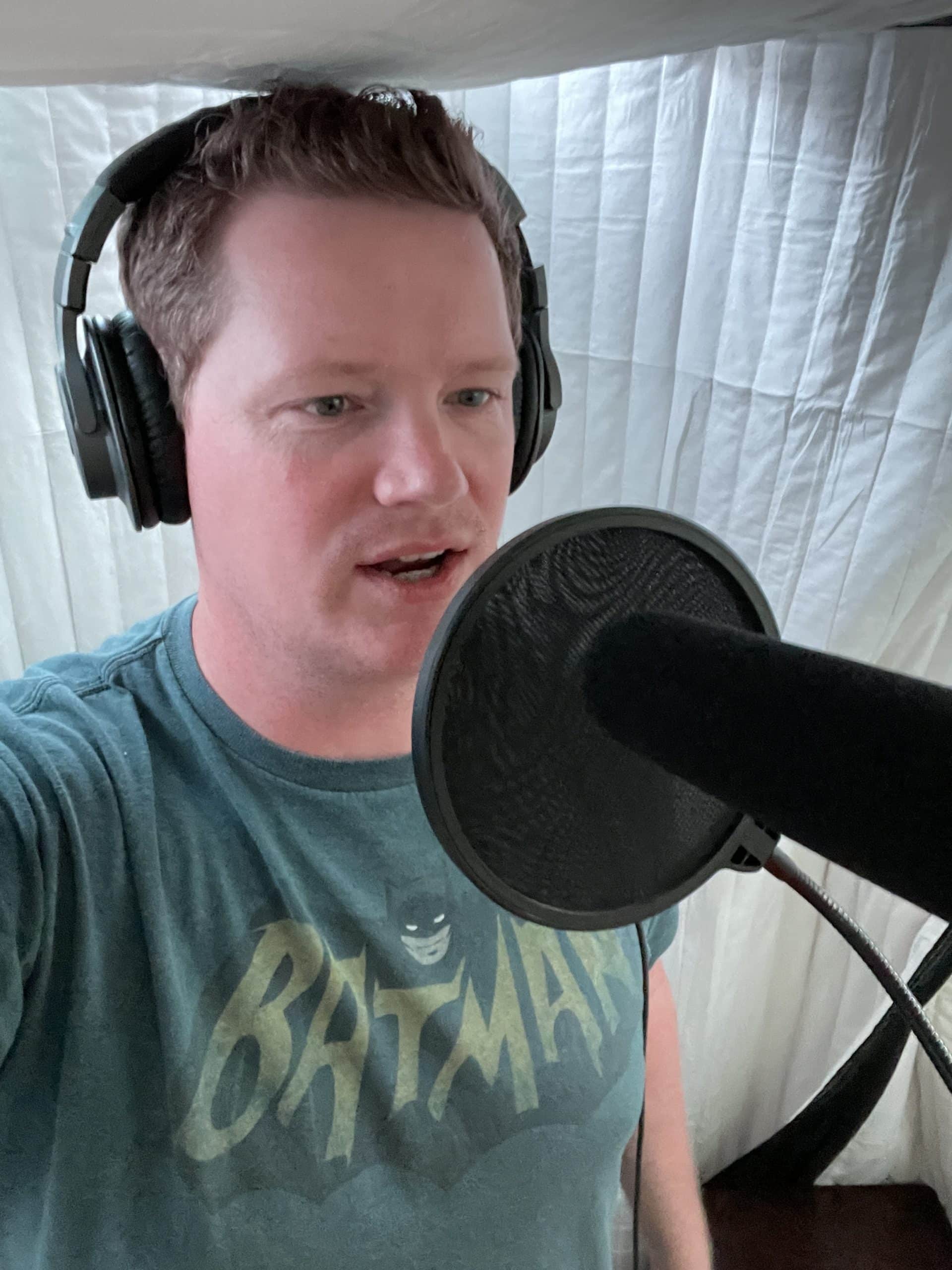 voice over artist Mike Thomas working in his vocal booth